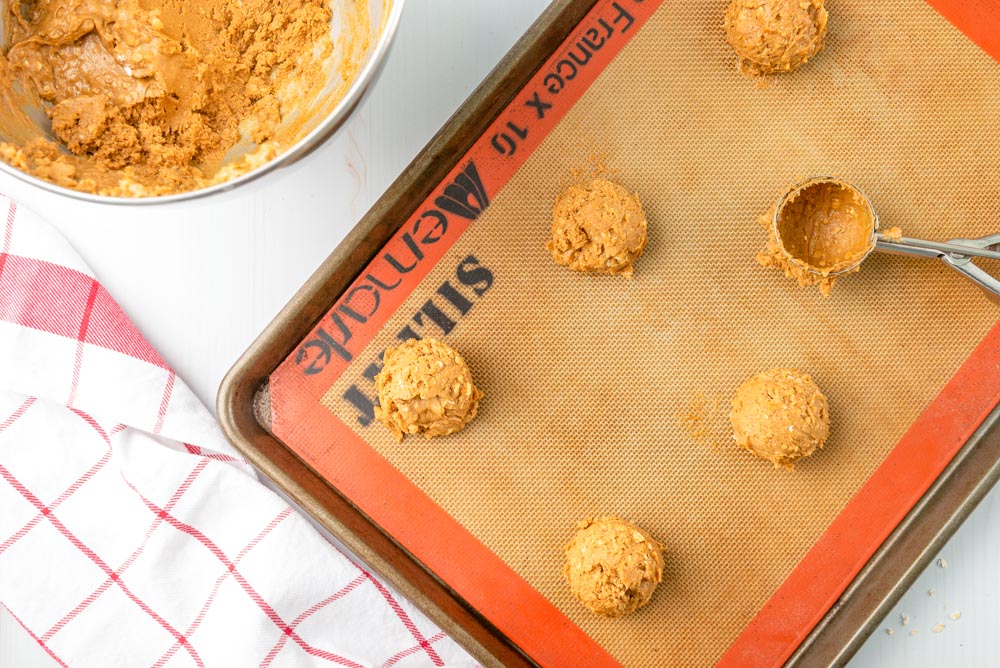Homemade oatmeal cream pies on a baking mat