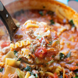 A ladle scooping easy lasagna soup.