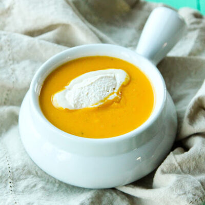 Butternut squash soup in a white bowl.