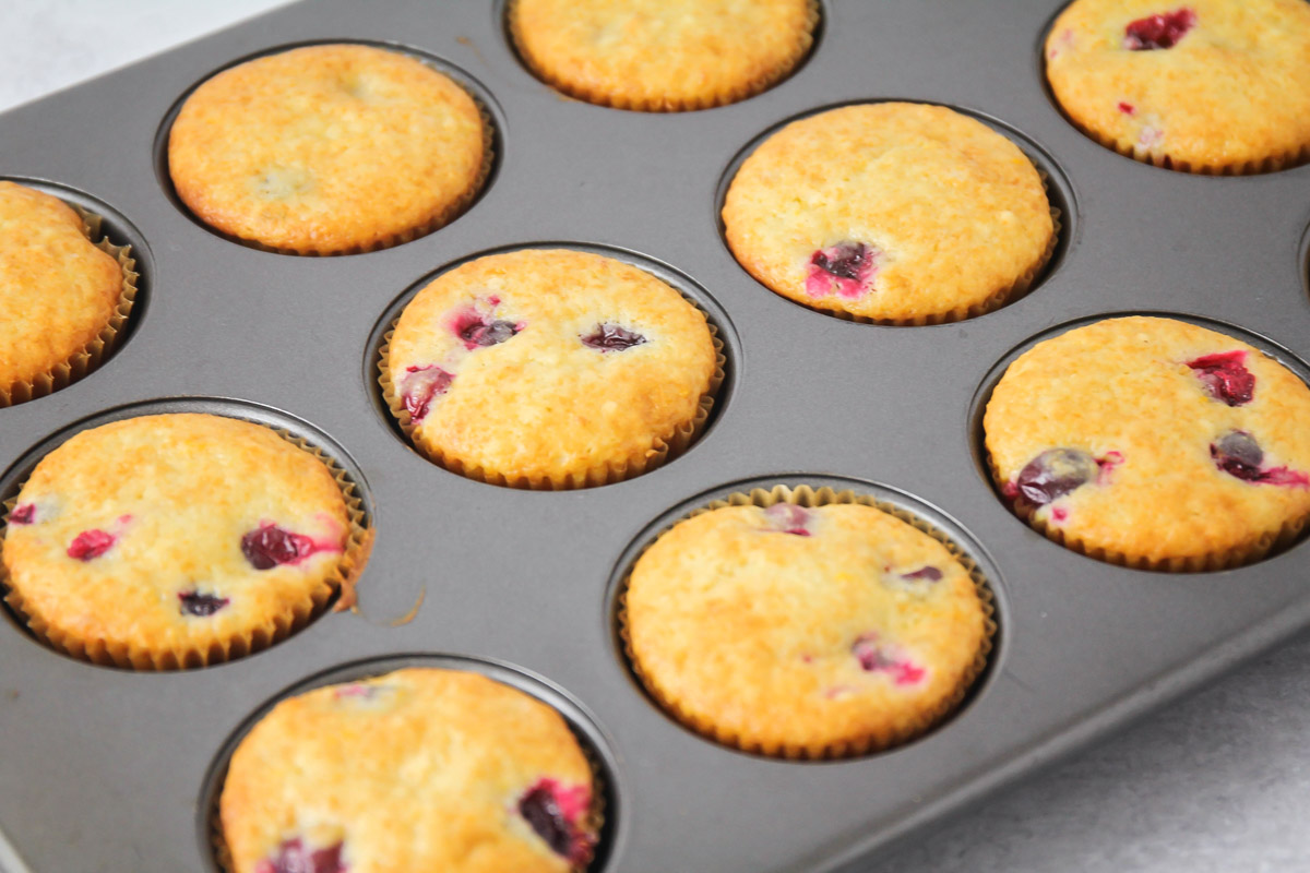 Cranberry Orange muffins in a baking tin