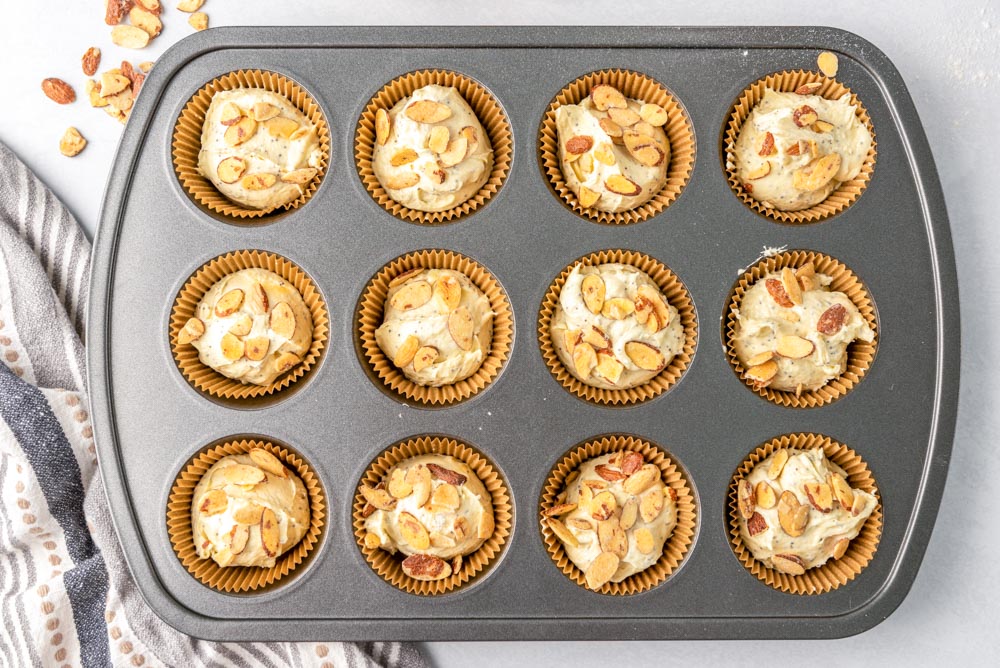 Almond poppy seed muffins with almonds sprinkled on top