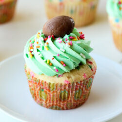 Easter cupcake on a white plate.