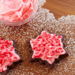 Peppermint chocolate Christmas cookies on a wooden surface.