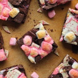 Chocolate peppermint bars on a wooden surface.