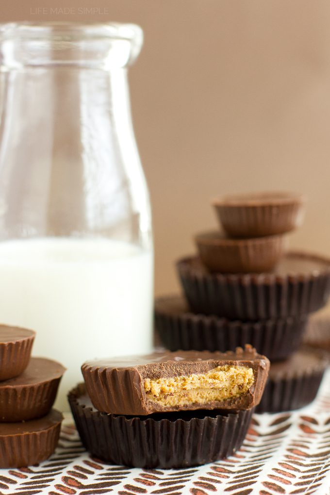 Homemade Creamy Peanut Butter Cups stacked next to milk