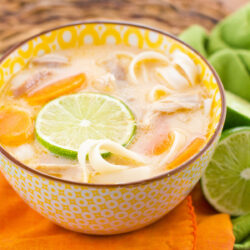 A bowl of Thai chicken noodle soup.