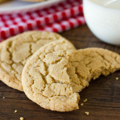 A soft and chewy peanut butter cookie broken in half.