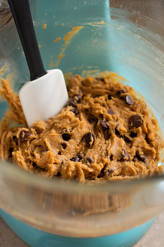 Cookie dough for Pumpkin Chocolate Chip Cookies in a mixing bowl
