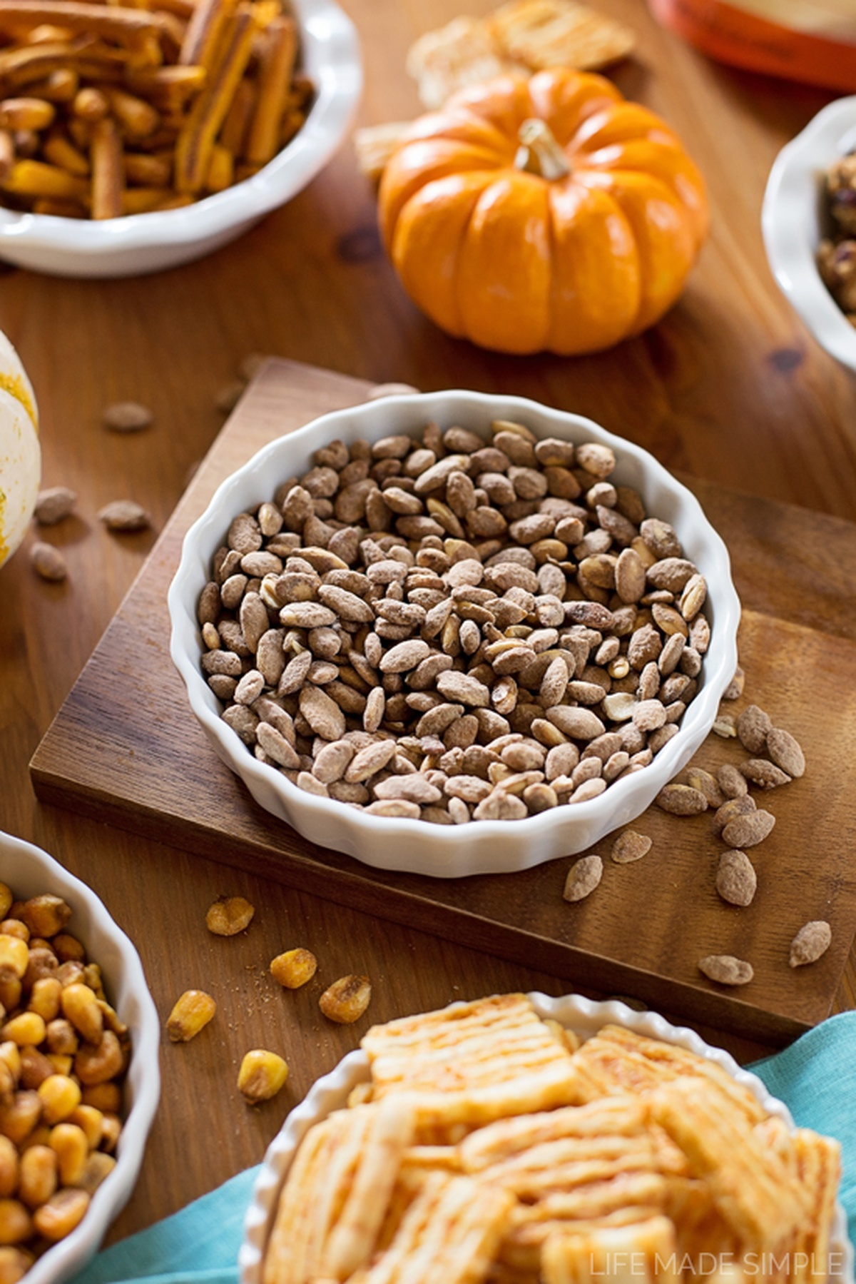 A close-up of a bowl filled with cinnamon-dusted almonds.