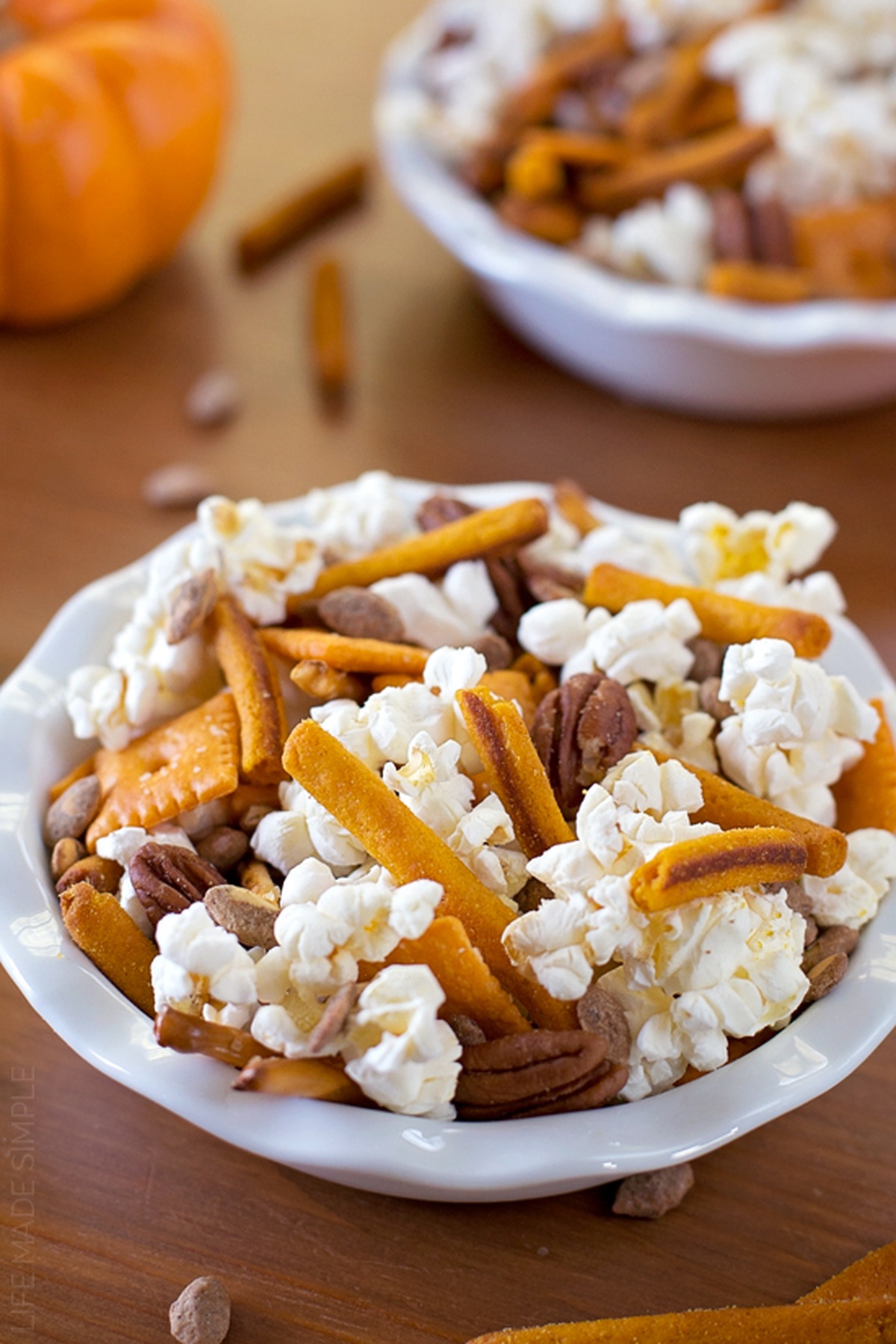 A close-up of a single bowl of fall snack mix.