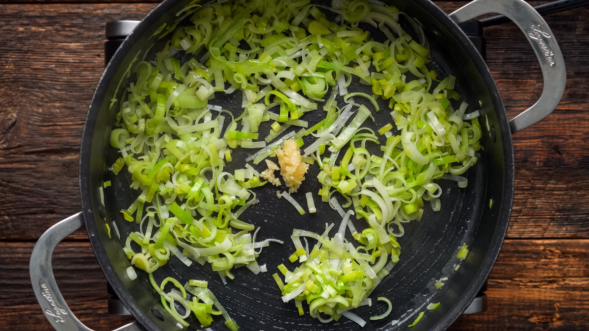 Garlic added into the skillet with the leeks.