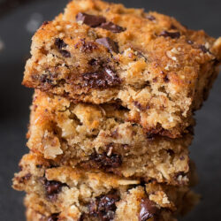A close-up stack of four chocolate chip snack cakes.