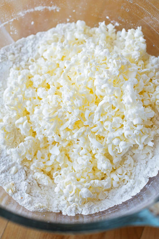 Mixing ingredients for buttermilk biscuit recipe in a glass bowl