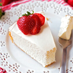 A slice of no bake strawberry cheesecake served on a plate.