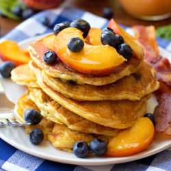Blueberry Peach Cornmeal Pancakes | lifemadesimplebakes.com