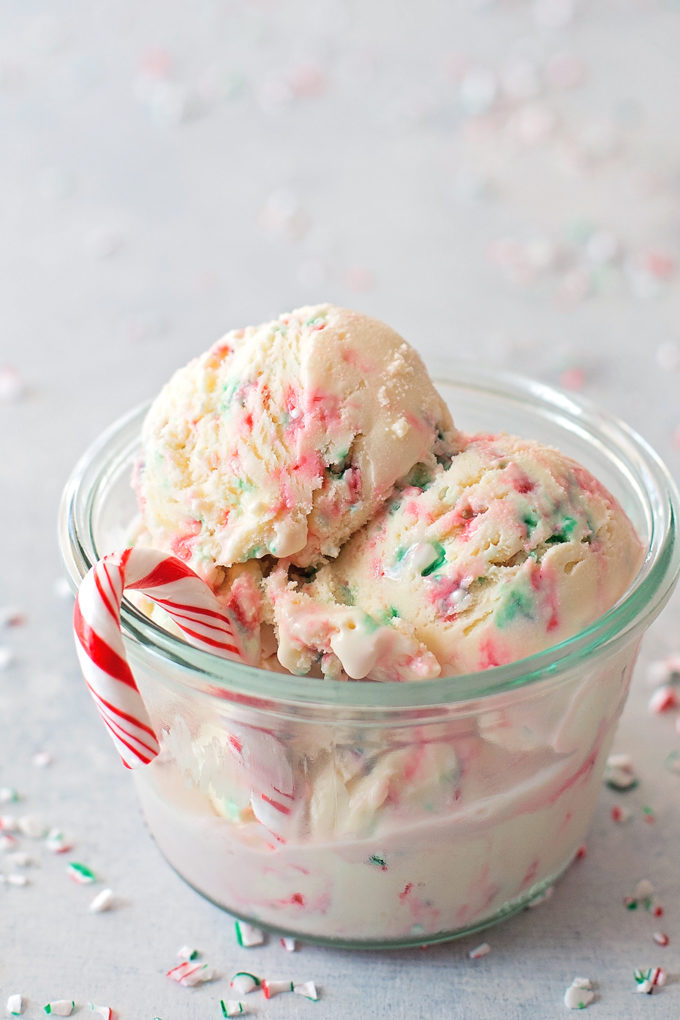 Peppermint Stick Ice Cream in a glass bowl with a mini candy cane