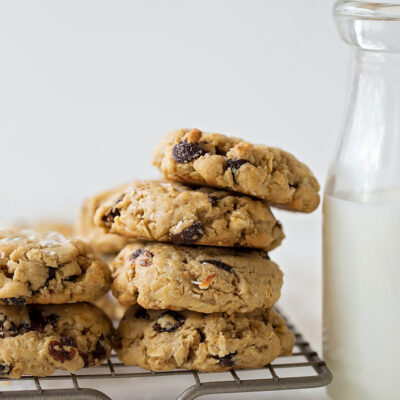Coconut oil oatmeal raisin cookies on a wire rack.