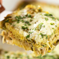A baking dish with a slice of Chicken Tamale Casserole.