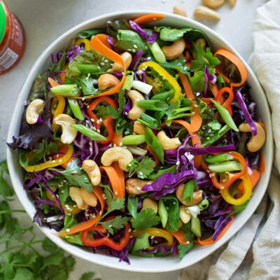Chopped Thai salad served in a white bowl.