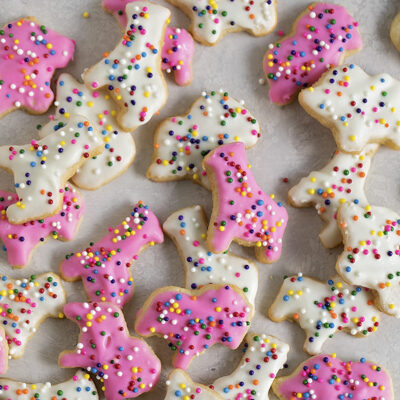 Frosted animal cookies on parchment paper.