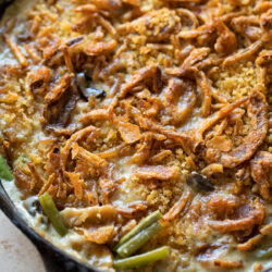 Freshly baked green bean casserole in a cast iron skillet.