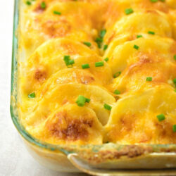 Cheesy Au Gratin Potatoes in a glass dish.