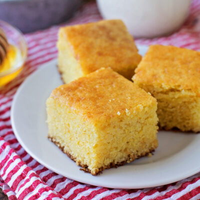 A white plate with buttermilk cornbread.