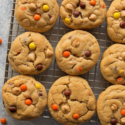 Peanut butter chip cookies cooling on a wire rack.