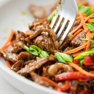Szechuan beef served on a plate.