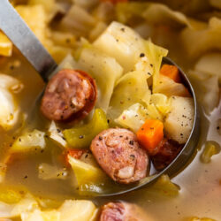 Hearty and Savory, this Cabbage Sausage Soup recipe Is Easy To Make And Oh So Delicious. This Nourishing Bowlful Is Low In Carbs Too!