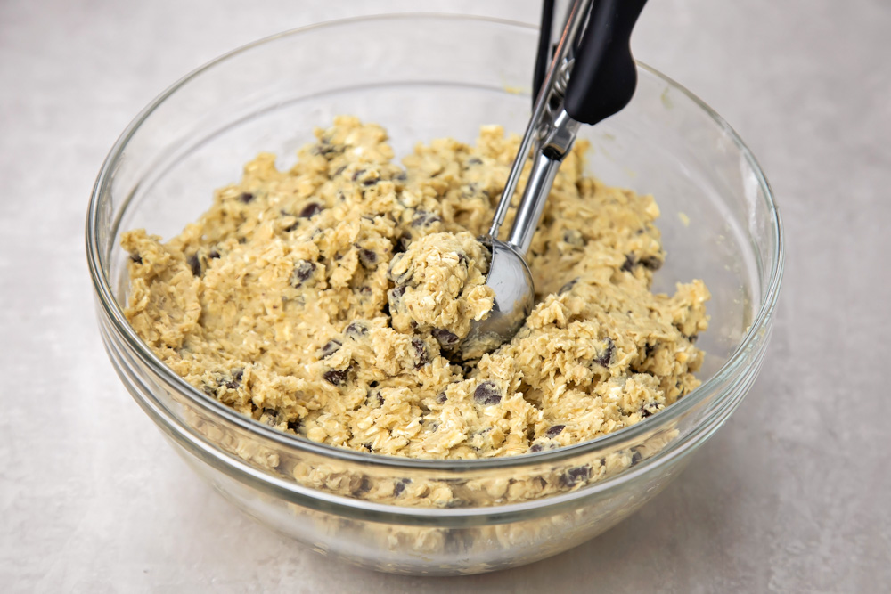 Oatmeal chocolate chip cookie dough in a mixing bowl