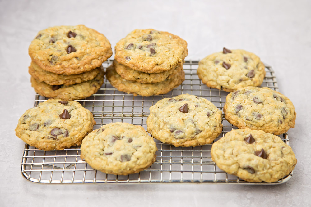 Oatmeal chocolate chip cookies on a cooling rack