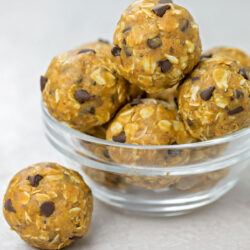 Flaxseed peanut butter balls with chocolate chips in a glass bowl.