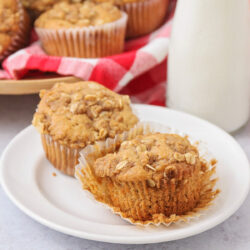 Apple pie muffins served on a white plate.