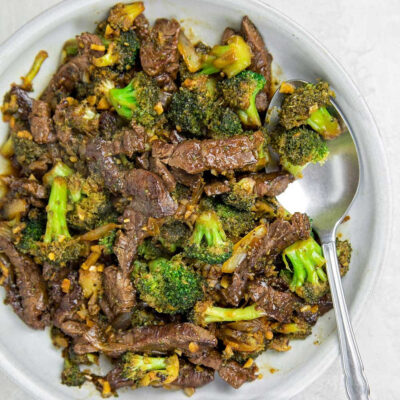 A bowl with beef and broccoli.
