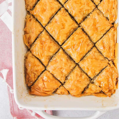 Baklava pastry arranged in a baking dish.