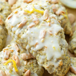 Lemon scones topped with almonds and glaze.