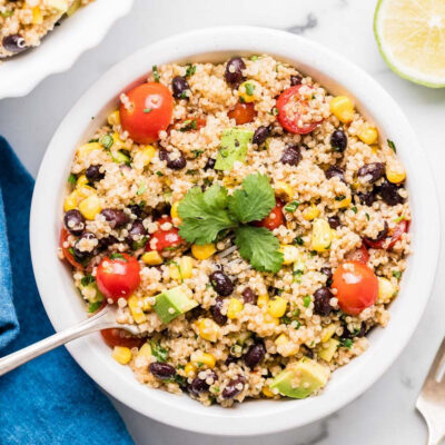 A serving bowl filled with southwest quinoa salad.