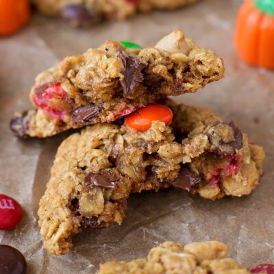 Pumpkin monster cookies on a parchment paper.