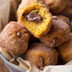 Nutella donut holes on a white plate.