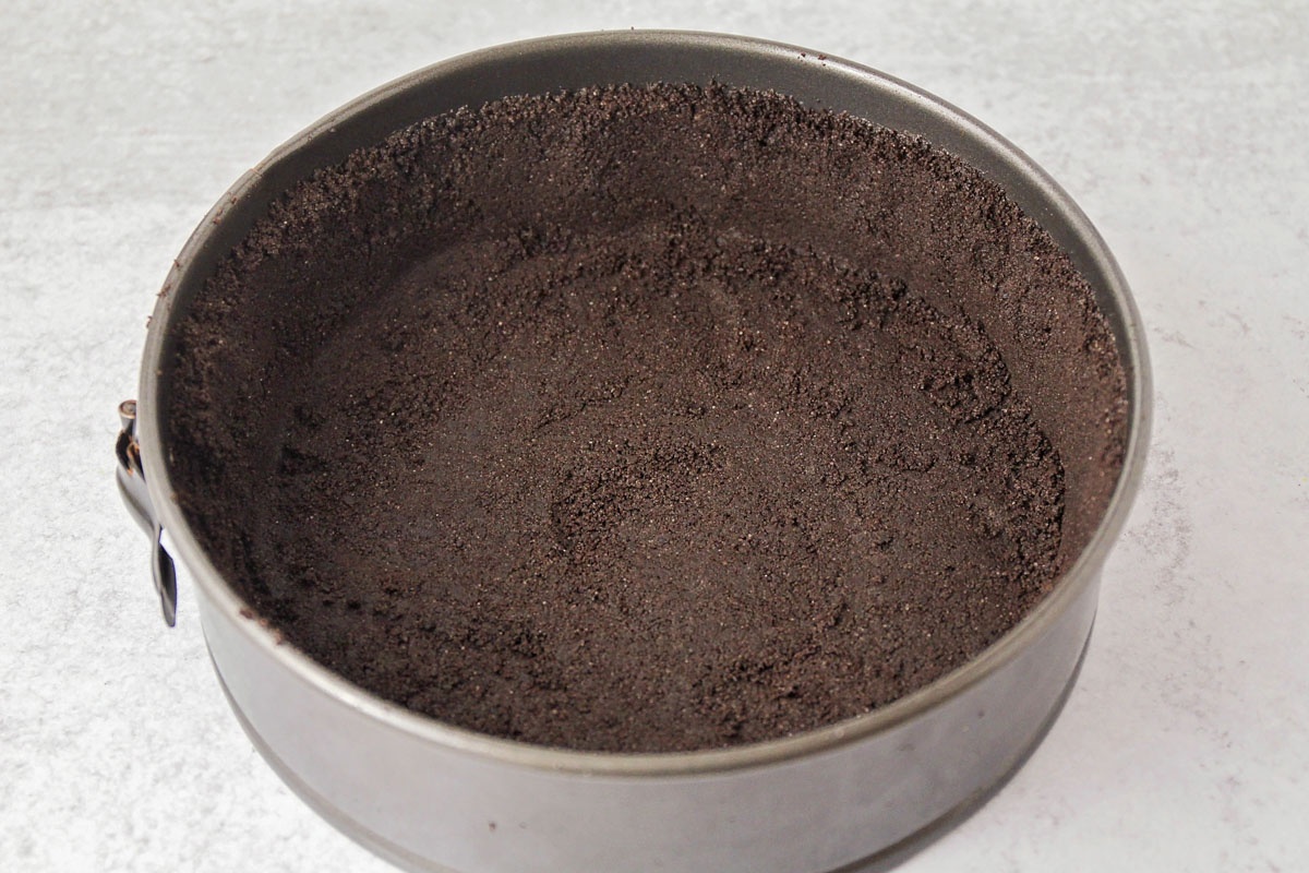 A prepared Oreo crumb crust pressed firmly into the bottom and sides of a springform pan.