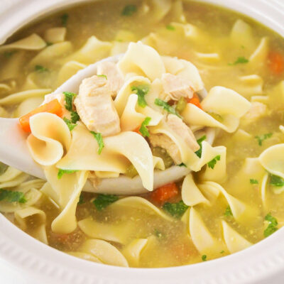 Easy Instant Pot chicken noodle soup served in a white bowl.