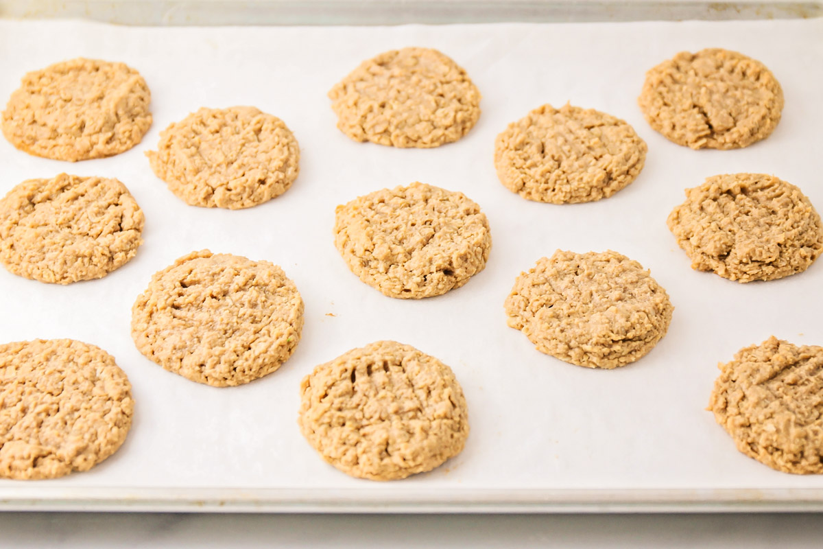 Healthy peanut butter cookies baked on parchment paper.