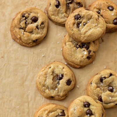Chocolate chip cookies with coconut oil on a parchment paper.
