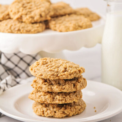 A stack of healthy peanut butter cookies on a white plate.