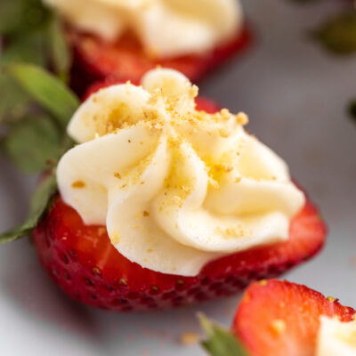 These Cheesecake Stuffed Strawberries are the perfect dessert that combines the natural sweetness from strawberries with a smooth and tangy cream cheese frosting on top.