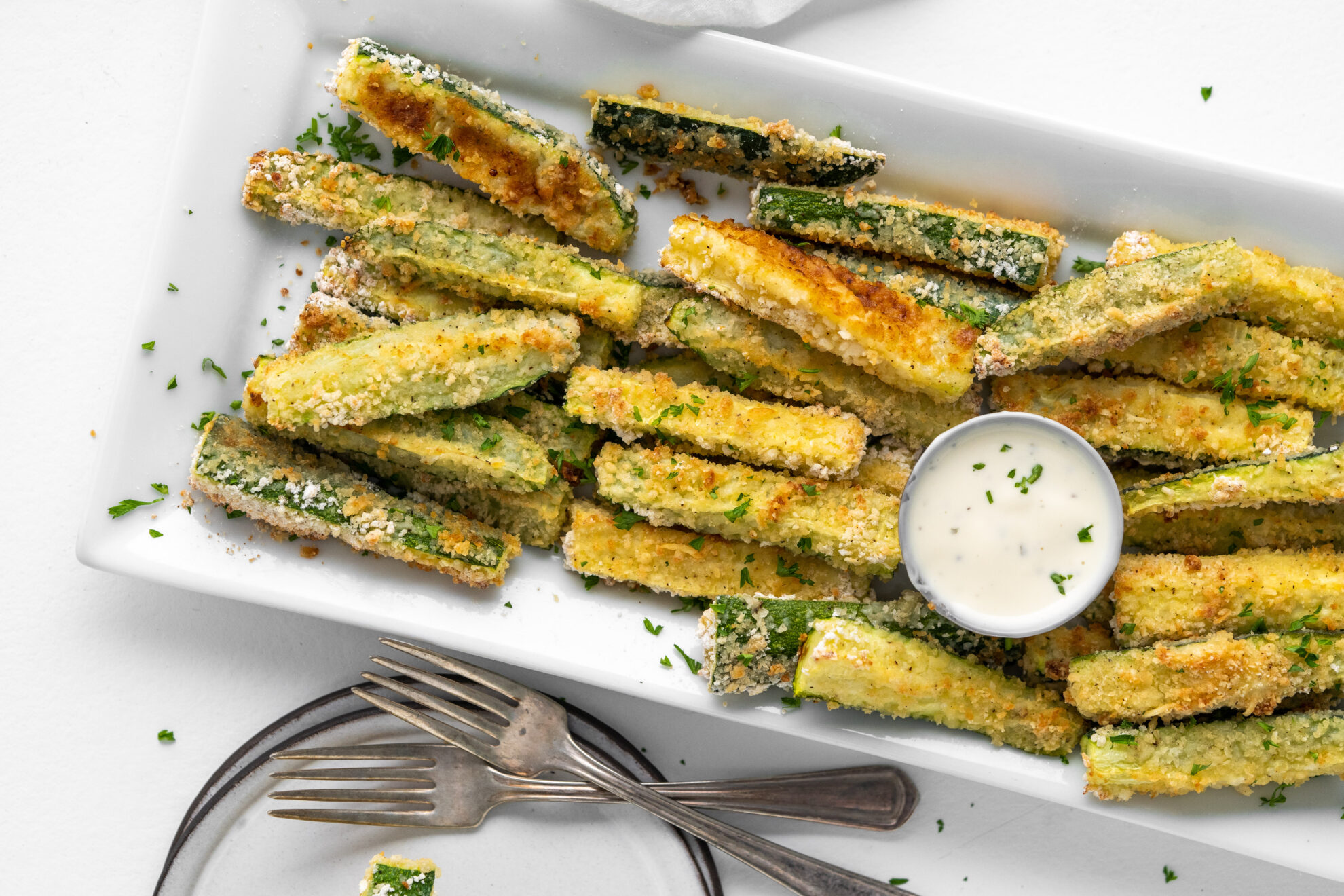 Zucchini fries on a white plate
