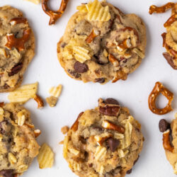 These Kitchen Sink Cookies are chewy, crunchy, and bursting with all of your favorite salty and sweet mix-ins!