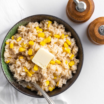 Corn Rice served in a black bowl.