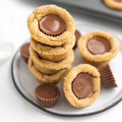 Reeses Cookies piled on a light grey plate.